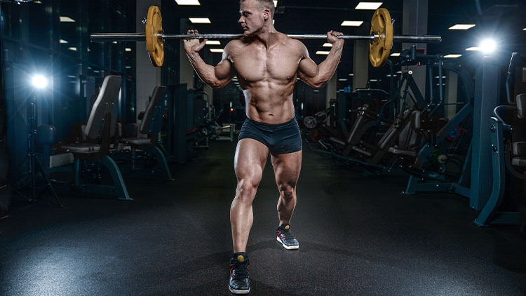 Handsome model young man training legs in gym