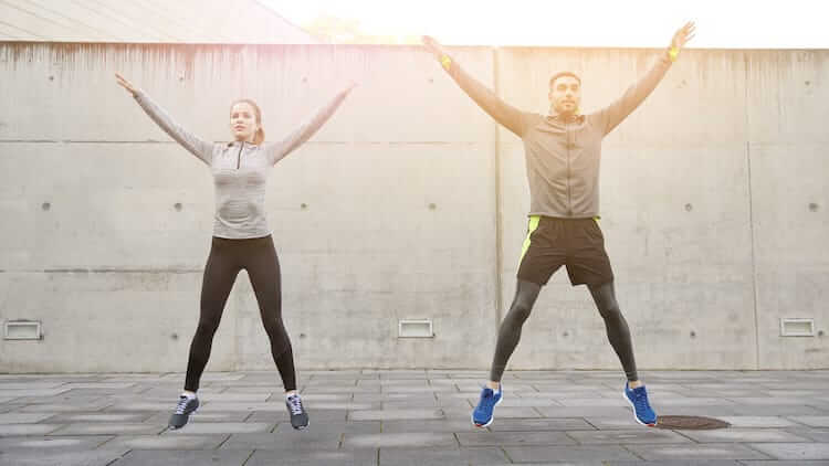 man and woman doing warm-up exercises